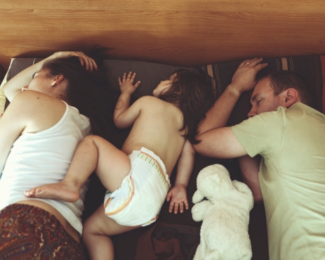 Family of three sleeping